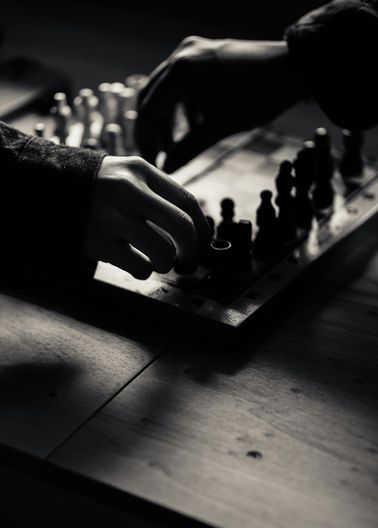 hands playing chess