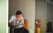stressed man sitting at table with laptop