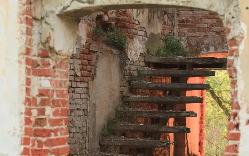 dilapidated home interior and stairs
